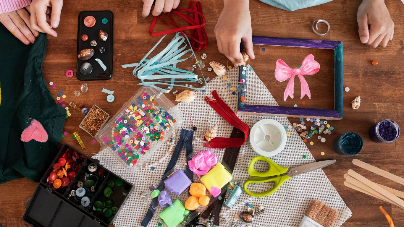 Kids crafting with ribbons, buttons, sequins, and paint fun and easy DIY creative activities at home.