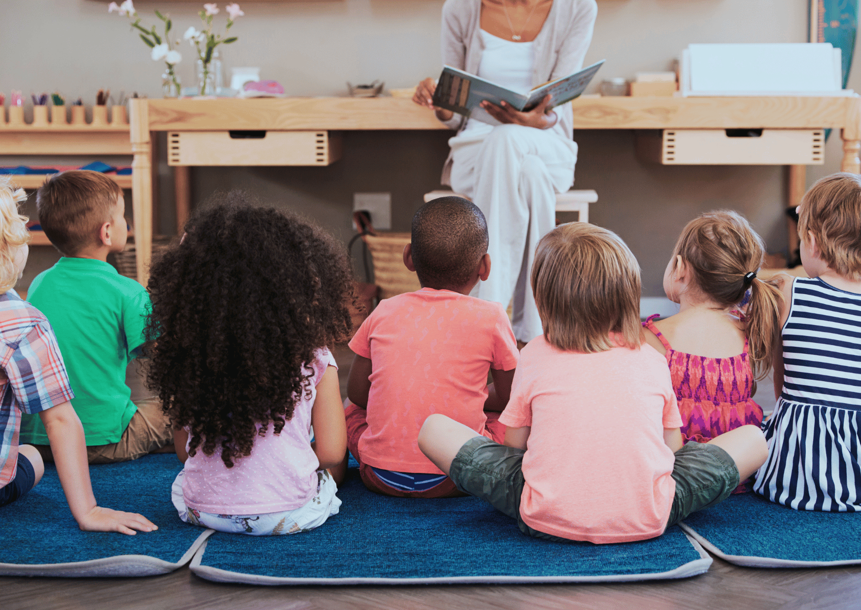 kids listening to Montessori teacher 