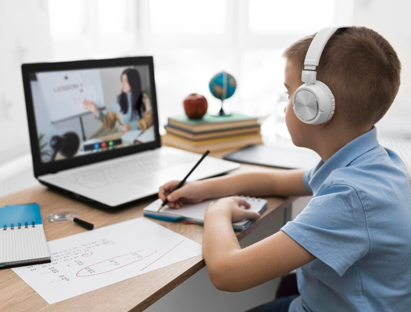A kid attending online classes 