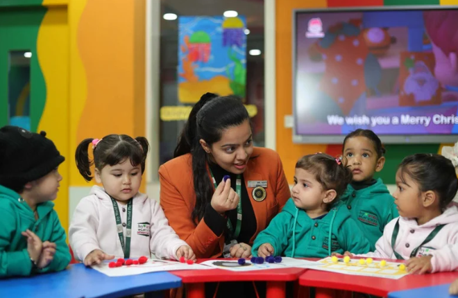 A Montessori teacher engages a group of preschool children in a hands-on classroom activity using colorful counters, fostering interactive and child-centered learning in a vibrant early education setting.