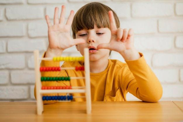 kid playing with abacus 